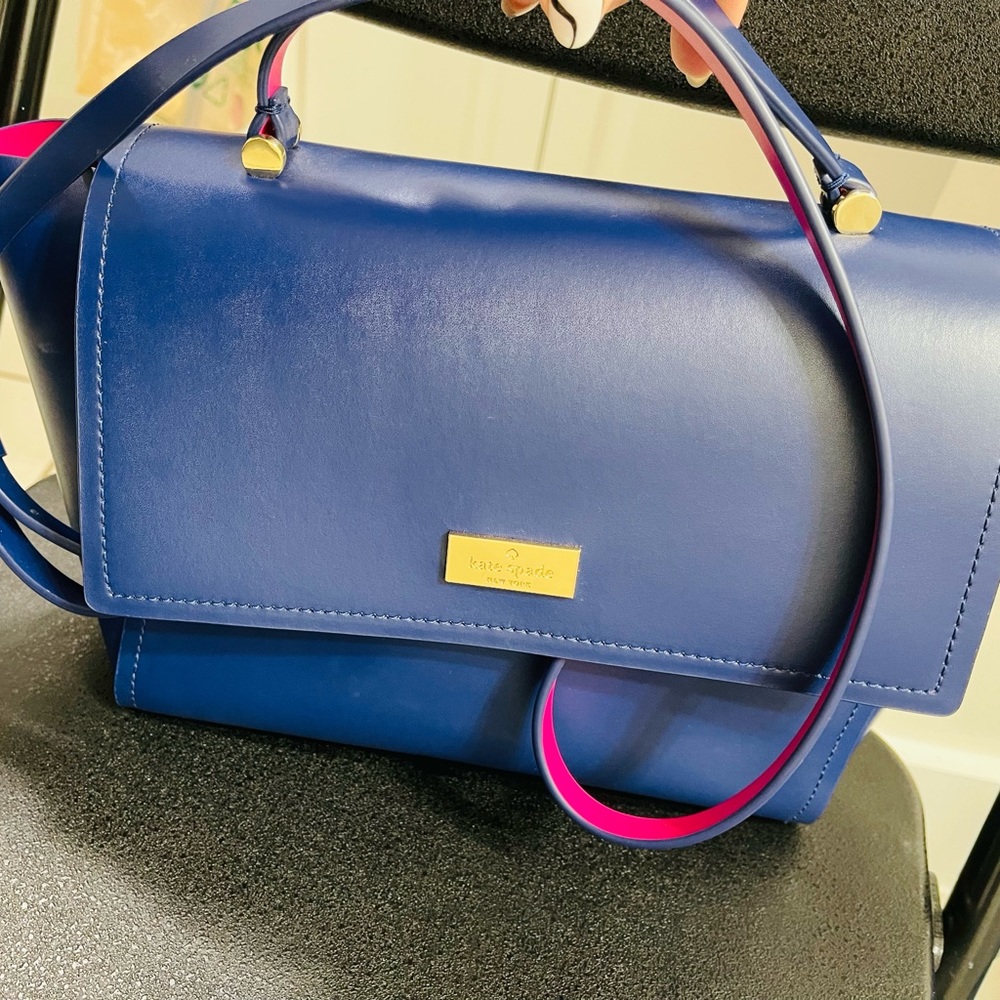 Like new ,1 or 2 use beautiful bag blue and pink inside